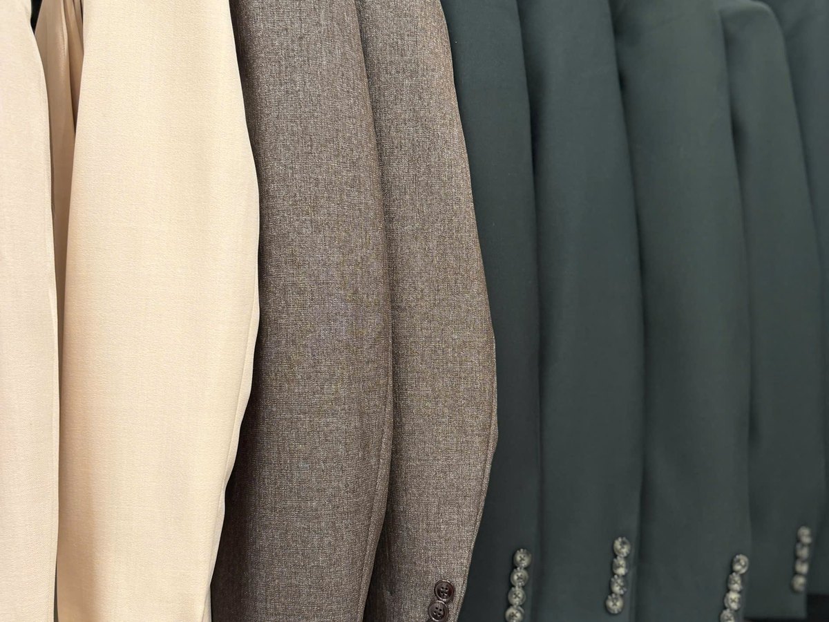 Selecting fabrics and colours for made-to-measure dresses at We Are Suitable, Singapore