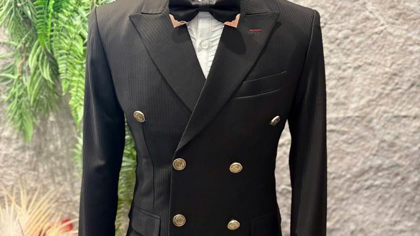 Black double-breasted suit with bow tie by We Are Suitable Singapore