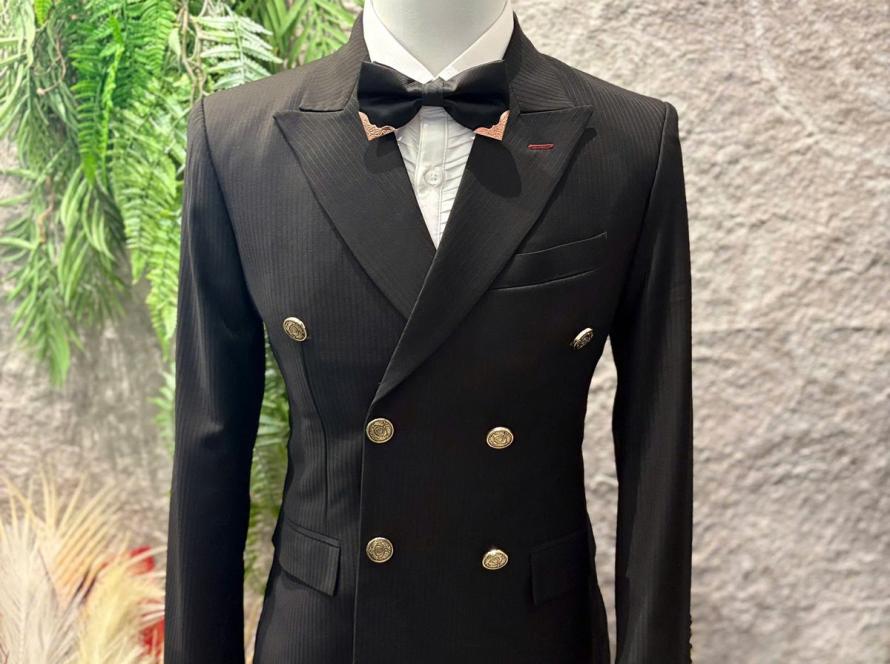 Black double-breasted suit with bow tie by We Are Suitable Singapore