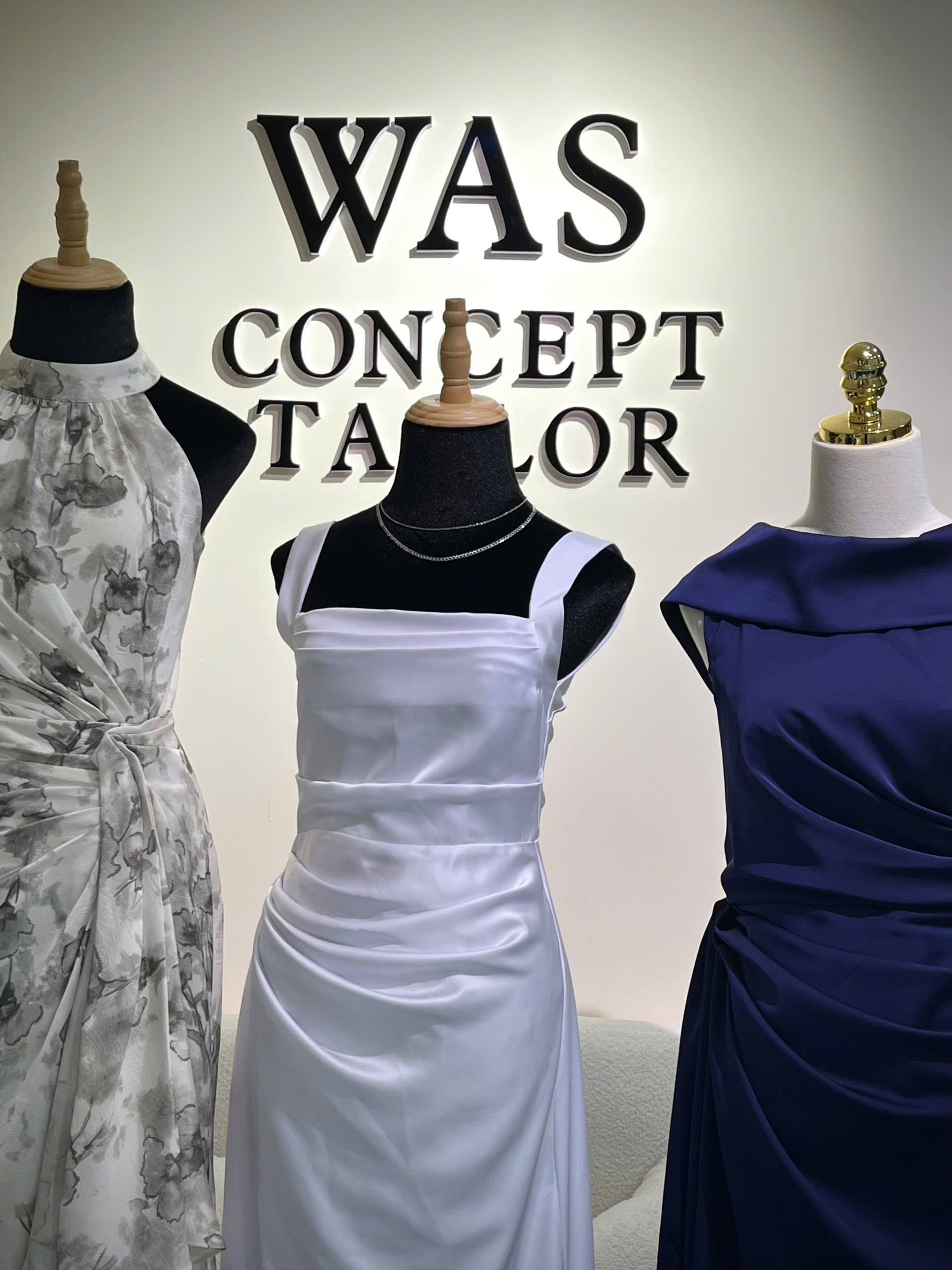 Three custom bridesmaid dresses in grey floral, white satin and navy, tailored by We Are Suitable in Singapore