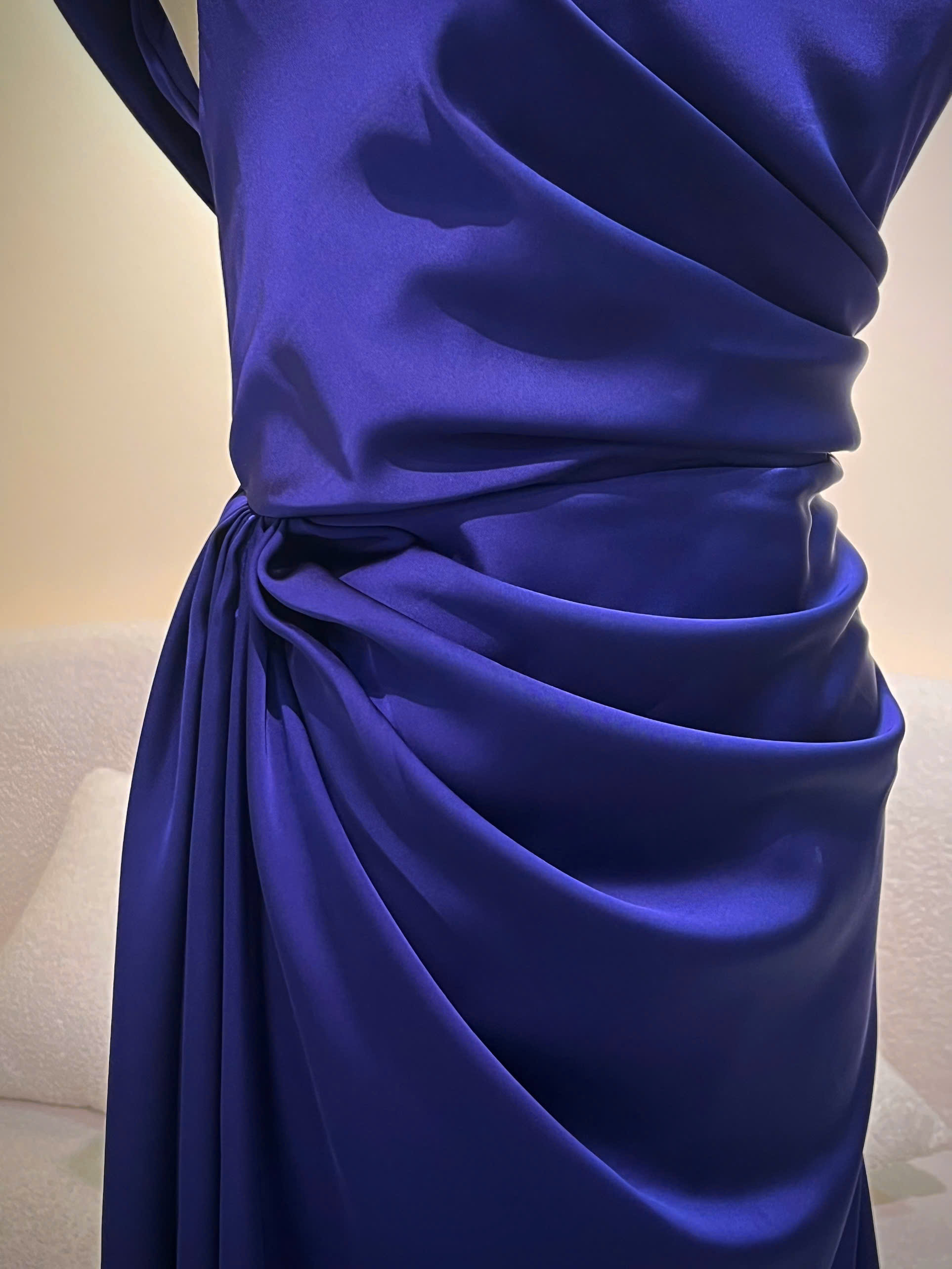 Draped-waist detail of a navy satin bridesmaid gown tailored in Singapore