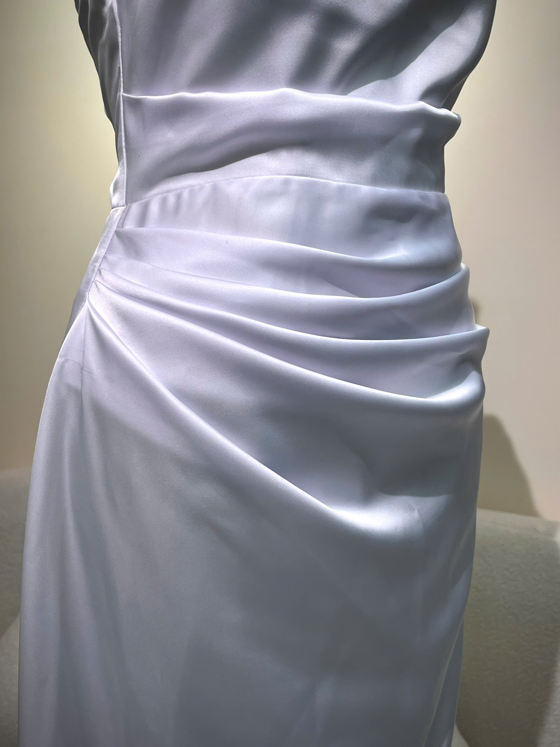 Ruched-waist detail of a white satin bridesmaid gown tailored in Singapore